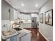 Modern kitchen featuring granite countertops, stainless steel appliances, and white cabinets at 8146 Viscount Ct, Denver, NC 28037