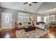 Inviting living room showcasing hardwood floors, comfortable seating, and natural light at 8146 Viscount Ct, Denver, NC 28037