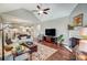 Spacious living room featuring hardwood floors, a fireplace, and a vaulted ceiling at 8146 Viscount Ct, Denver, NC 28037