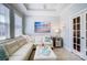 Comfortable living room with white sectional sofa and beachy art at 8146 Viscount Ct, Denver, NC 28037
