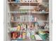 Organized pantry with wire shelves fully stocked with various food items at 8146 Viscount Ct, Denver, NC 28037