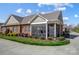Beautiful brick home featuring a lovely screened-in porch and well-maintained landscaping at 8146 Viscount Ct, Denver, NC 28037