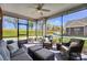 Comfortable screened-in porch with ample seating, offering a relaxing view of the surrounding landscape at 8146 Viscount Ct, Denver, NC 28037