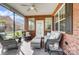 Inviting screened-in porch with comfortable seating, perfect for relaxation and enjoying the outdoors at 8146 Viscount Ct, Denver, NC 28037