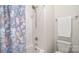 Clean bathroom featuring a shower/tub combo with patterned shower curtain and tile, plus essential fixtures and fittings at 8534 Loxton Cir, Charlotte, NC 28214