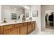 Bathroom featuring a double vanity, modern fixtures, and plenty of cabinet space at 8534 Loxton Cir, Charlotte, NC 28214