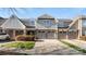 Charming townhome with attached garages, stone accents and manicured lawn at 8534 Loxton Cir, Charlotte, NC 28214