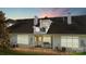 Back view of house exterior with balcony, windows, and outdoor seating at 8534 Loxton Cir, Charlotte, NC 28214