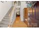 Inviting foyer with hardwood floors, staircase, and elegant decor at 8534 Loxton Cir, Charlotte, NC 28214