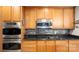 Modern kitchen features granite countertops, stainless steel appliances, and gas range at 8534 Loxton Cir, Charlotte, NC 28214