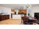 Open kitchen with stainless steel appliances, granite countertops, adjacent dining area at 8534 Loxton Cir, Charlotte, NC 28214