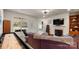 Open concept living room with fireplace and comfortable seating bathed in natural light at 8534 Loxton Cir, Charlotte, NC 28214