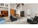 Comfortable living room with a ceiling fan, a fireplace, and a view into the main bedroom at 8534 Loxton Cir, Charlotte, NC 28214