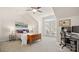 Bright main bedroom with a ceiling fan, a chest, and a desk with monitors at 8534 Loxton Cir, Charlotte, NC 28214