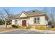 Exterior view of the real estate office showcasing its architectural details, including stone accents and double doors at 8534 Loxton Cir, Charlotte, NC 28214