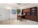 Inviting office with hardwood built-ins, a desk, and a comfortable desk chair at 8534 Loxton Cir, Charlotte, NC 28214