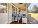 Cozy screened-in patio with comfortable seating, perfect for outdoor relaxation at 8534 Loxton Cir, Charlotte, NC 28214