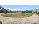 Community tennis courts featuring green surface, dark fencing and paved walkway in a lovely setting at 8534 Loxton Cir, Charlotte, NC 28214