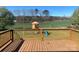 Enjoy the scenic outdoor views from this deck overlooking the backyard with playground equipment at 9450 Paul Payne Store Rd, Stony Point, NC 28678