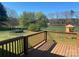 Enjoy the scenic outdoor views from this deck overlooking the backyard with playground equipment at 9450 Paul Payne Store Rd, Stony Point, NC 28678