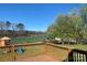 Enjoy the scenic outdoor views from this deck overlooking the backyard with playground equipment at 9450 Paul Payne Store Rd, Stony Point, NC 28678
