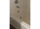 A white bathtub has a shower faucet and drain, ready for a new owner to enjoy at 9450 Paul Payne Store Rd, Stony Point, NC 28678