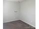 A simple bedroom with carpet, electric outlets, and fresh paint on the walls at 9450 Paul Payne Store Rd, Stony Point, NC 28678