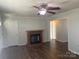 Cozy living room featuring a fireplace and hardwood floors at 9450 Paul Payne Store Rd, Stony Point, NC 28678