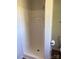 A stand-up shower with a white surround, ready for a new owner to enjoy at 9450 Paul Payne Store Rd, Stony Point, NC 28678