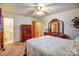 Bedroom with closet and ensuite featuring carpet and ceiling fan at 9534 Markus Dr, Mint Hill, NC 28227