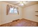 Simple bedroom with a window and neutral walls, awaiting personalization at 9534 Markus Dr, Mint Hill, NC 28227