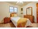 Bright bedroom featuring carpet, bed, ceiling fan, and dresser at 9534 Markus Dr, Mint Hill, NC 28227