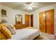 Bedroom featuring carpet, bed, ceiling fan, dresser, and closet at 9534 Markus Dr, Mint Hill, NC 28227