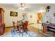 Charming dining area with wooden table and chairs, adjacent to the kitchen at 9534 Markus Dr, Mint Hill, NC 28227