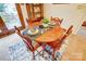 Close-up of dining table with charming decor, floral centerpiece, and place settings at 9534 Markus Dr, Mint Hill, NC 28227