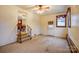 View of living room featuring wood-trim window, white door and staircase at 9534 Markus Dr, Mint Hill, NC 28227