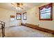 Large living room with brick detailing, white walls, and multiple windows at 9534 Markus Dr, Mint Hill, NC 28227