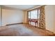 Spacious living room featuring vintage wallpaper, a large window, and a decorative table at 9534 Markus Dr, Mint Hill, NC 28227