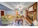 Bright living room with a brick fireplace, comfortable seating, and a decorative area rug at 9534 Markus Dr, Mint Hill, NC 28227