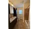 Well-maintained bathroom with brown tile accents, vanity, and natural light at 100 Chadmore Dr, Charlotte, NC 28270
