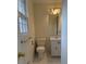 Well-lit bathroom with a white vanity, mirror, and a window at 100 Chadmore Dr, Charlotte, NC 28270