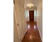 Hallway featuring hardwood floors and white trim at 100 Chadmore Dr, Charlotte, NC 28270