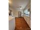 Kitchen with stainless steel appliances, white cabinets, and hardwood floors at 100 Chadmore Dr, Charlotte, NC 28270