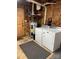 Functional laundry area with washer, dryer, and water heater at 100 Chadmore Dr, Charlotte, NC 28270
