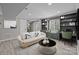 Finished basement with built-in shelving, desk, and cozy seating area at 10405 Club Car Ct, Mint Hill, NC 28227