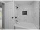 Bathroom featuring a tiled shower with a built-in niche and black fixtures at 10405 Club Car Ct, Mint Hill, NC 28227