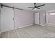 Bedroom with a barn door, ceiling fan, walk-in closet, and ensuite bathroom at 10405 Club Car Ct, Mint Hill, NC 28227