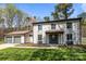 Charming two-story home with a well-manicured lawn and two-car detached garage at 10405 Club Car Ct, Mint Hill, NC 28227