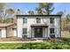 Charming two-story home featuring neutral siding, a covered porch, and well-maintained landscaping at 10405 Club Car Ct, Mint Hill, NC 28227