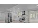 Bright kitchen featuring white cabinets, stainless steel appliances, and modern finishes at 10405 Club Car Ct, Mint Hill, NC 28227